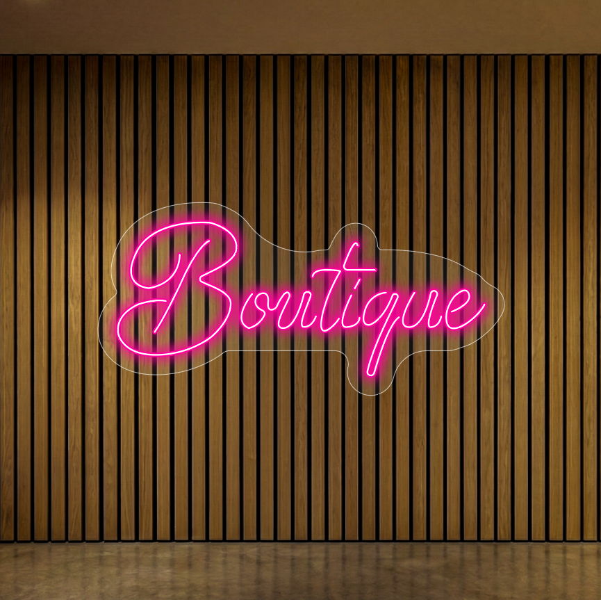 Neon z napisem "Boutique" na tle lameli