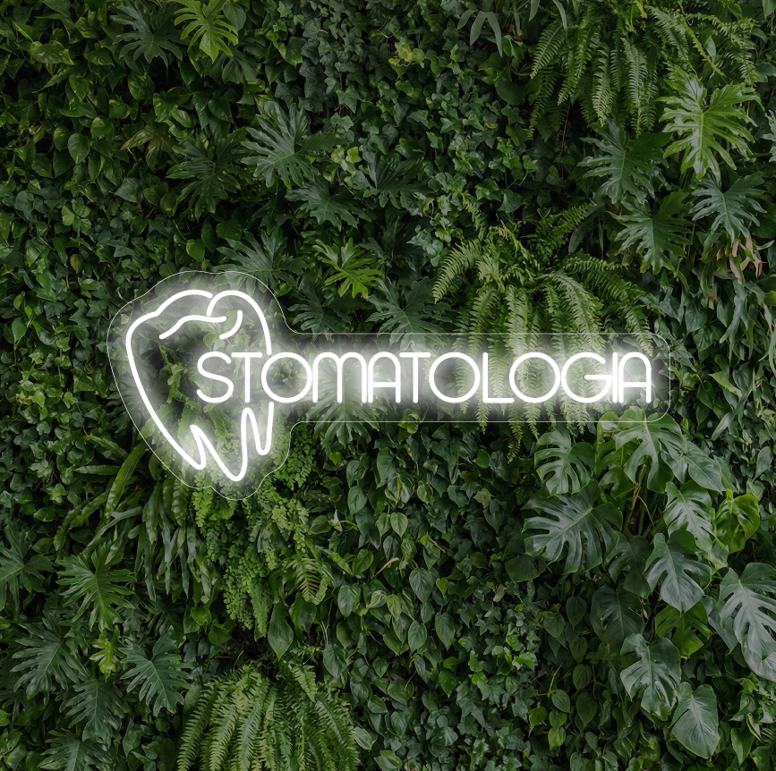 Neon z wizuerunkiem zęba i napisem "stomatologia" na tle ścianki z iści