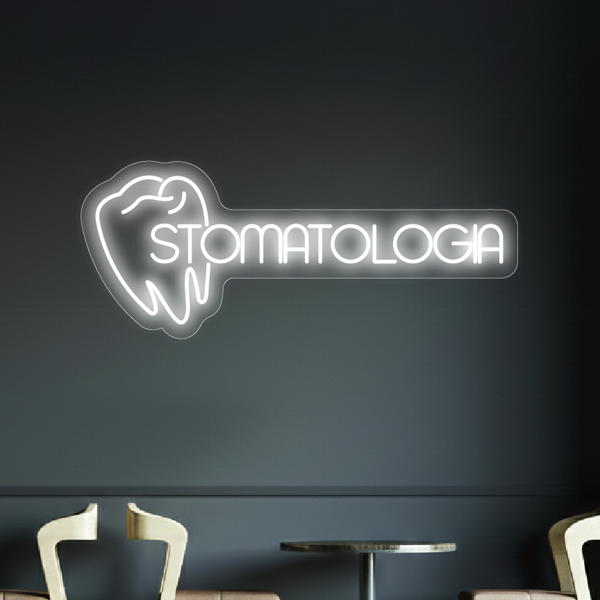 neon z napisem "stomatologia" na tle ciemnej ściany w poczekalni gabinetu stomatologicznego
